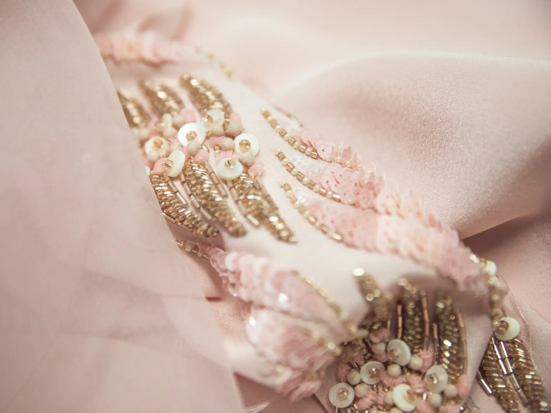 Close-up of intricately beaded fabric at CMT Studio London