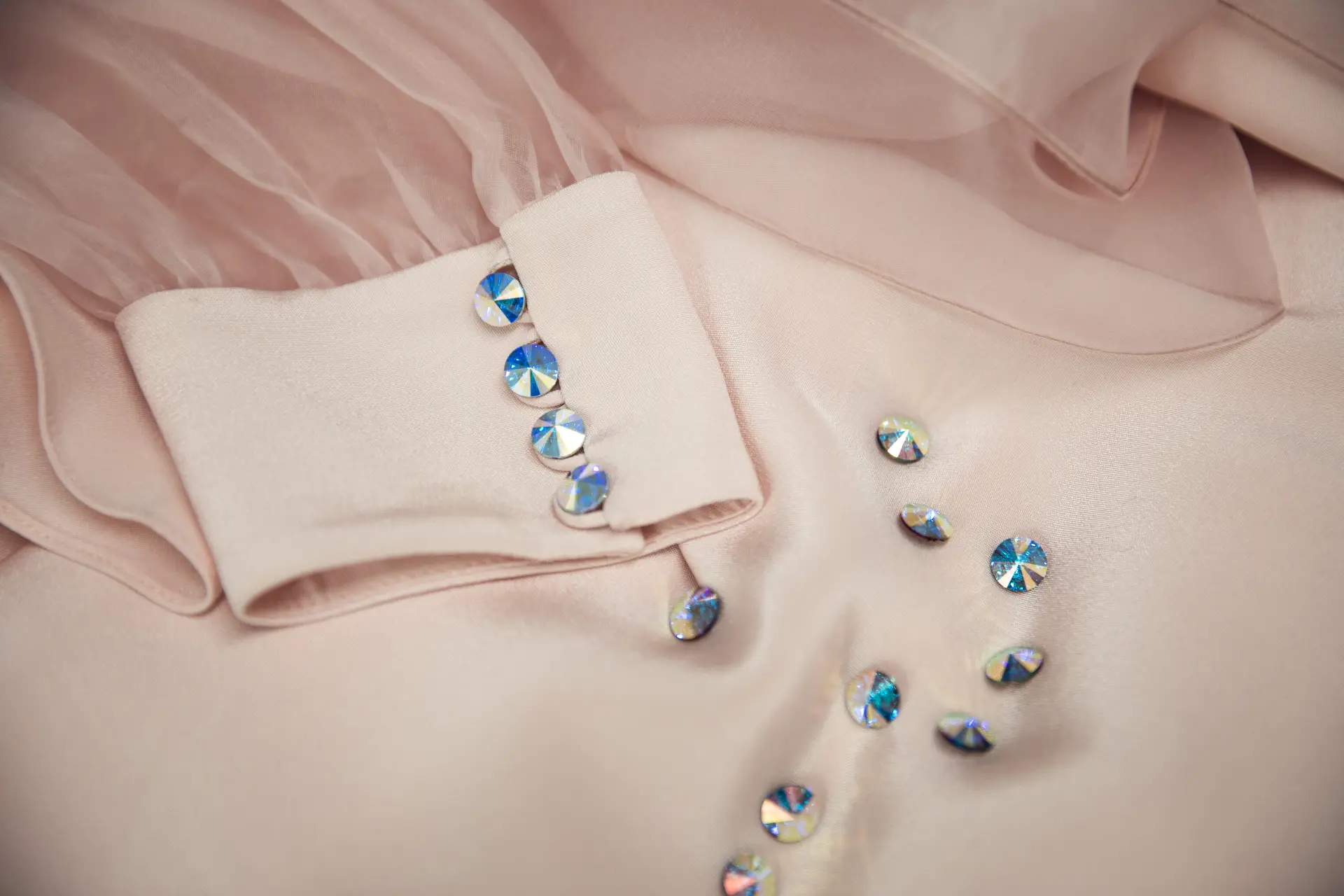 Fabric-covered buttons on a finished dress at CMT Studio London