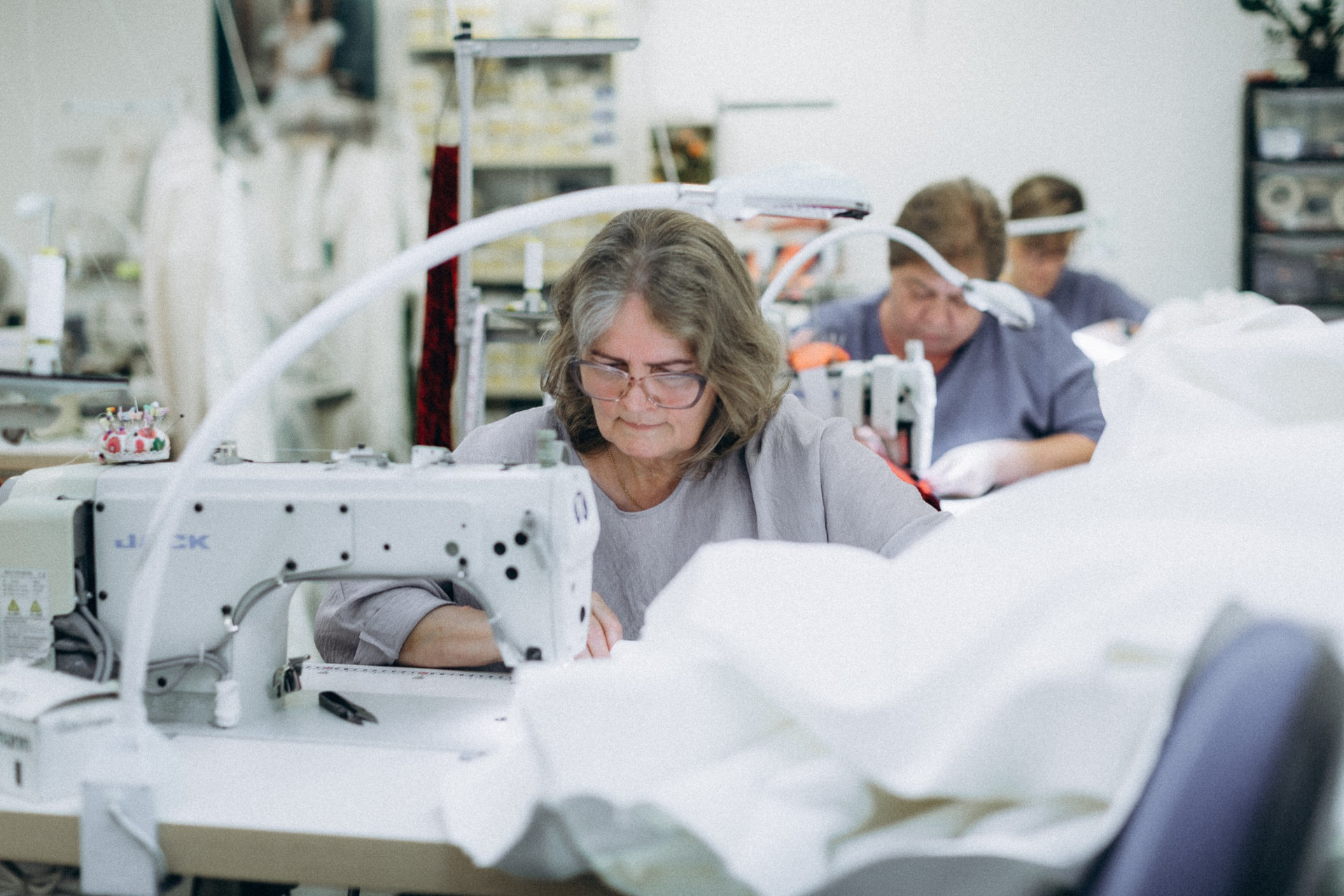 Machinists sewing garments in the CMT Studio workroom